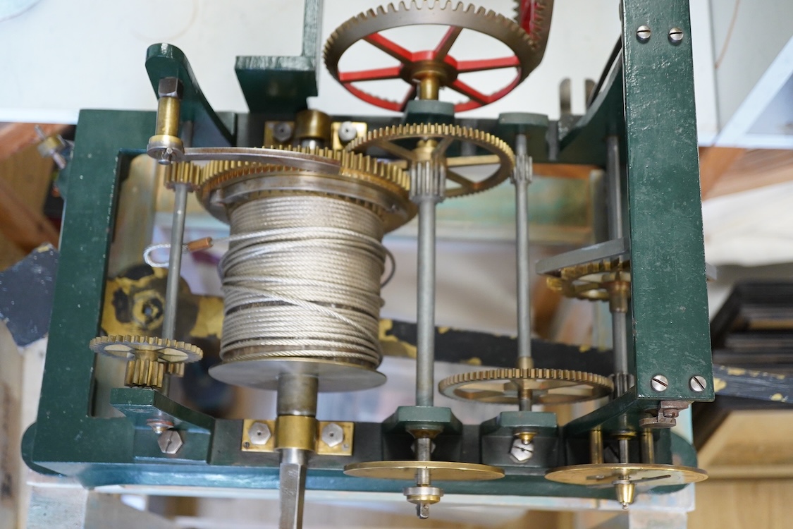 A late 19th century turret timepiece, understood to have been possibly built by Kemp of Bristol, green painted cast iron frame, with pendulum, weight, winding handle, and other unrestored parts, including the drive mecha